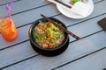 Asian soup noodles with chicken and vegetables served on a table Royalty Free Stock Photo