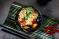 Asian soup with noodles ramen, with miso paste, soy sauce, mussels and shrimps prawn. On a dark stone table, with Royalty Free Stock Photo
