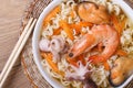 Asian soup with seafood and noodles with chopsticks close up. Royalty Free Stock Photo