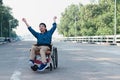 Special child on wheelchair is happily on mangrove forest background Royalty Free Stock Photo