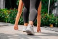 Asian sport girl doing stretching, yoga fitness and plank exercise outside. Fit young thai woman doing training workout Royalty Free Stock Photo