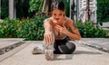 Asian sport girl doing stretching, yoga fitness and plank exercise outside. Fit young thai woman doing training workout Royalty Free Stock Photo