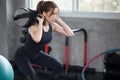 asian sport woman in sportswear exercise squat with with training weight bag in fitness gym . young girl workout with lifting wei