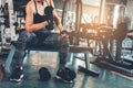 Asian sports woman doing exercises with dumbbell weights in gym Royalty Free Stock Photo