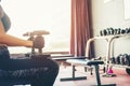 Asian sports woman doing exercises with dumbbell weights in gym Royalty Free Stock Photo