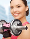 Asian sporty woman with heavy dumbbell Royalty Free Stock Photo