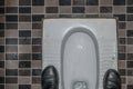 Dirty Asian Restroom with Asian Squat Toilet