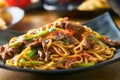 Asian stir fried noodles with beef peppers and onions Royalty Free Stock Photo
