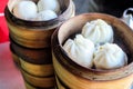 Asian street food concept, Chinese steamed pork buns. Chinese breakfast. chinese steamed bun in traditional bamboo steamer Royalty Free Stock Photo