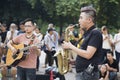 Asian street musician performing with their instruments