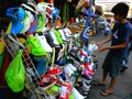 Asian street vendor selling rubber shoes in quiapo, manila, philippines in asia