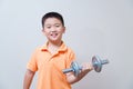 Asian strong boy lifting weights,