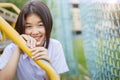 Asian student girl teen innocent shy smiling and looking camera with copy space Royalty Free Stock Photo