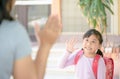 Student going to school and waving goodbye Royalty Free Stock Photo