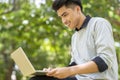 Asian student Using laptop