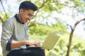 Asian student Using laptop in college Royalty Free Stock Photo