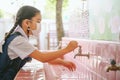 Asian student washing hands at the outdoor wash basin in the school. Preventing Contagious diseases, Plague. Kids health,