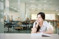 Asian student wondering or thinking about something Royalty Free Stock Photo