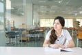 Asian student wondering or thinking about something Royalty Free Stock Photo