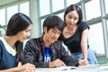 Asian student working home work togather in library in university