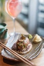 Asian Style Beef Tartare with Pan-Fried Rice Cake and Black Truffle Royalty Free Stock Photo