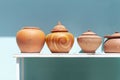Brown pottery pots are placed in rows to decorate the house Royalty Free Stock Photo