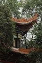 Asian-style building featuring an exterior of bright orange tiled roofing