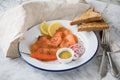 Asian style Gravlax a raw, marinated graved salmon with lemongrass and chili  on enamel plate with toast bread, Scandinavian Royalty Free Stock Photo