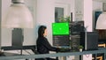 Asian system engineer programming app code on monitors with greenscreen Royalty Free Stock Photo