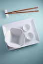 Asian table setting on blue background Royalty Free Stock Photo