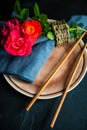 Asian table setting with red roses Royalty Free Stock Photo