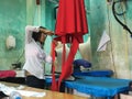 Asian Tailor with red dress