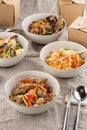 Asian take out food different noodles with box on grey table Royalty Free Stock Photo