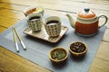 Asian tea set type on wood table with food and coffee