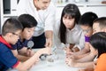 Asian teacher expanding to student in geology class with different of rock . Royalty Free Stock Photo