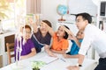 Asian teacher explains a human body structure to little pupil Royalty Free Stock Photo