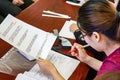 Asian teacher takes oral exam in chinese.