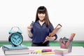 Asian teacher woman with files standing in the classroom with a whiteboard background Royalty Free Stock Photo