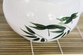 Asian teapot on bamboo mat plate Royalty Free Stock Photo