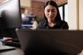 Asian tech enginner analyzing compiling html code
