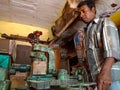 an asian technician operating wood chopping machine at workshop in india January 2020 Royalty Free Stock Photo