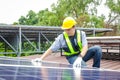 Asian technicians install panels Solar cells