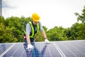 Asian technicians install panels Solar cells