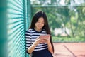 Asian teen age reading social media in computer tablet happiness Royalty Free Stock Photo