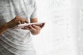 Asian teen buzy with his tablet in his home Royalty Free Stock Photo