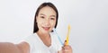 Asian teen facial with braces and toothbrush smiling to camera Royalty Free Stock Photo