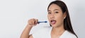 Asian teen facial with braces and toothbrush smiling to camera Royalty Free Stock Photo