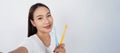 Asian teen facial with braces and toothbrush smiling to camera Royalty Free Stock Photo