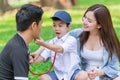 Asian teen family fun enjoy roleplay doctor in park holiday Royalty Free Stock Photo