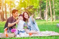 Asian teen family one kid happy holiday picnic moment in the park Royalty Free Stock Photo